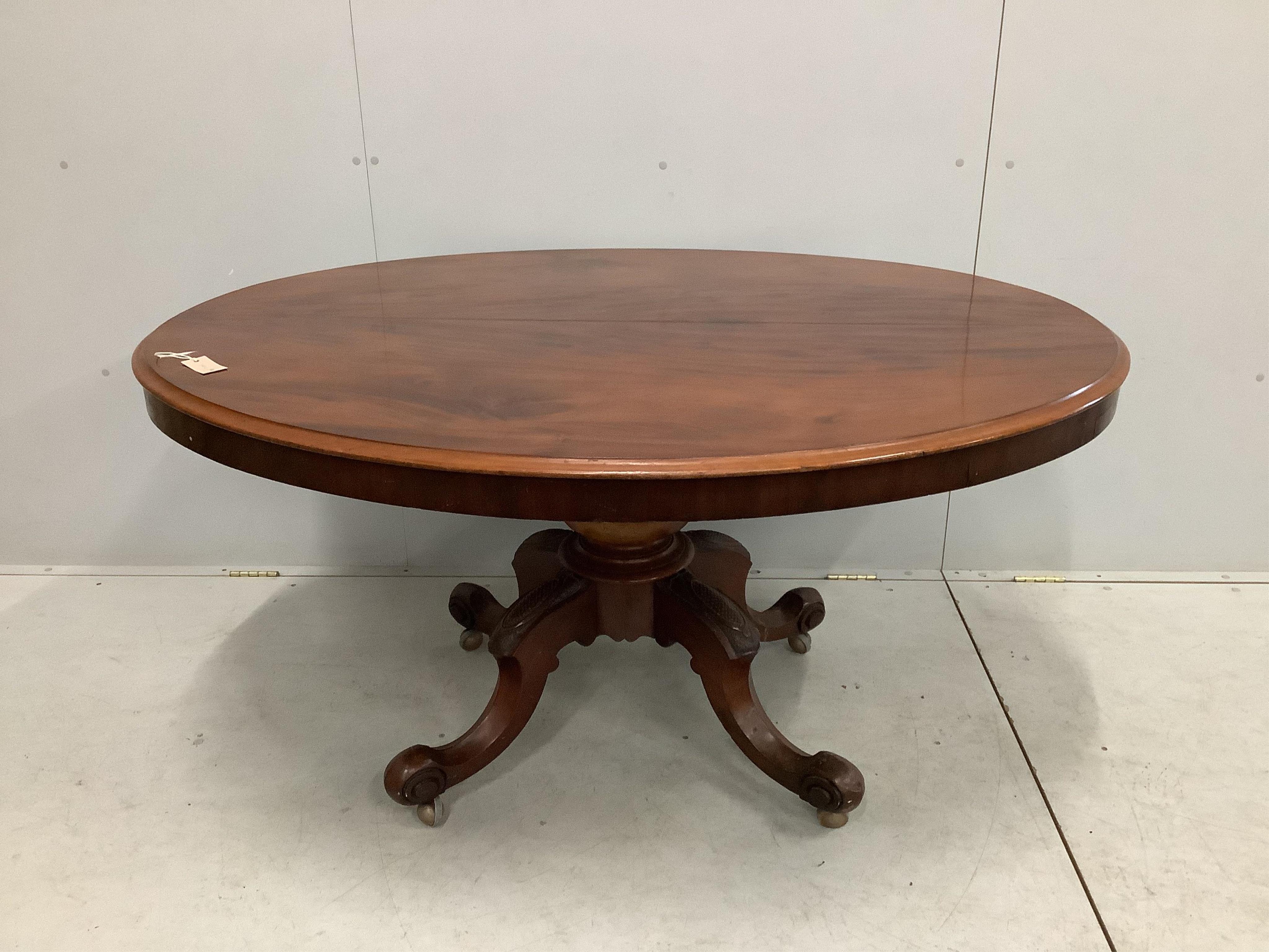 A Victorian oval mahogany tilt top loo table, diameter 146cm, depth 114cm, height 75cm. Condition - poor to fair